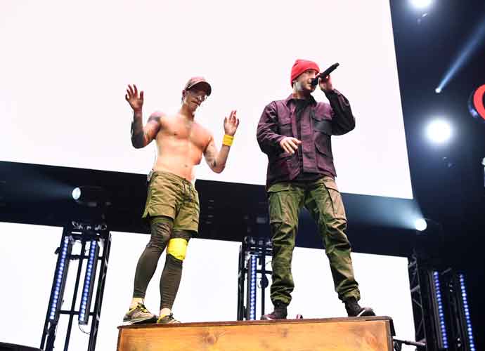 INGLEWOOD, CALIFORNIA - JANUARY 19: (L-R) Josh Dun and Tyler Joseph of Twenty One Pilots perform on stage during 2019 iHeartRadio ALTer Ego at The Forum on January 19, 2019 in Inglewood, California. (Photo by Emma McIntyre/Getty Images for iHeartMedia)