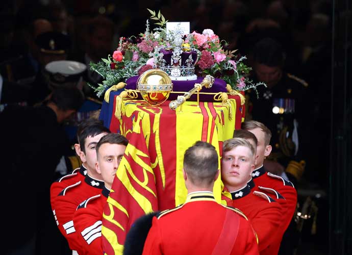 LONDON, ENGLAND - SEPTEMBER 19: The coffin is carried out of Westminster Abbey during the state funeral and burial of Queen Elizabeth II at Westminster Abbey on September 19, 2022 in London, England. Elizabeth Alexandra Mary Windsor was born in Bruton Street, Mayfair, London on 21 April 1926. She married Prince Philip in 1947 and ascended the throne of the United Kingdom and Commonwealth on 6 February 1952 after the death of her Father, King George VI. Queen Elizabeth II died at Balmoral Castle in Scotland on September 8, 2022, and is succeeded by her eldest son, King Charles III. (Photo by Hannah McKay - WPA Pool/Getty Images)