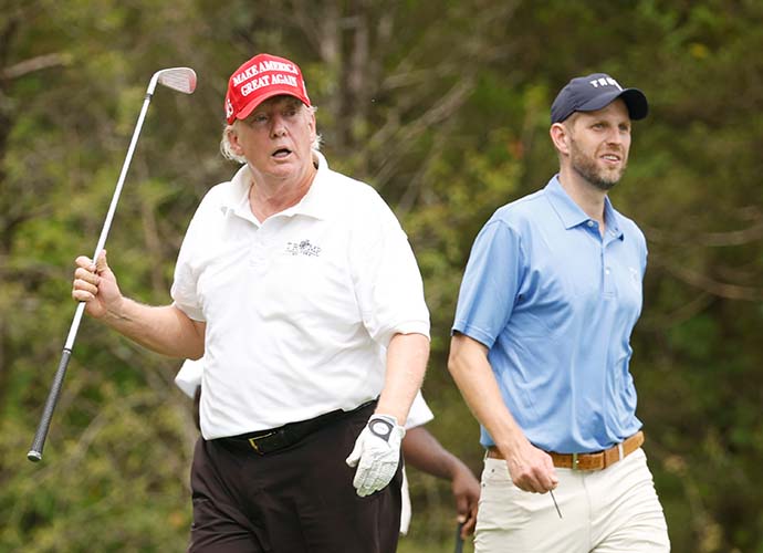 BEDMINSTER, NEW JERSEY - JULY 28: Former U.S. President Donald Trump and son Eric Trump take part in the pro-am prior to the LIV Golf Invitational - Bedminster at Trump National Golf Club Bedminster on July 28, 2022 in Bedminster, New Jersey. (Photo by Cliff Hawkins/Getty Images)