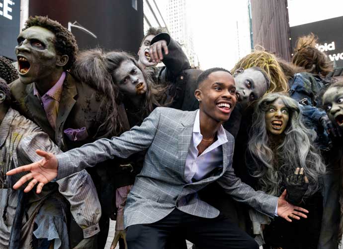 NEW YORK, NEW YORK - OCTOBER 28: Actor Tavon Olds-Sample poses with zombies for the 40th Anniversary of Michael Jackson’s 