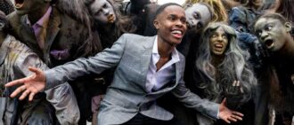 NEW YORK, NEW YORK - OCTOBER 28: Actor Tavon Olds-Sample poses with zombies for the 40th Anniversary of Michael Jackson’s "Thriller" in Times Square on October 28, 2022 in New York City. Members of the Michael Jackson estate and "MJ The Musical" rang the Nasdaq opening bell. "'Thriller" was originally released on November 30, 1982. (Photo by Alexi Rosenfeld/Getty Images)