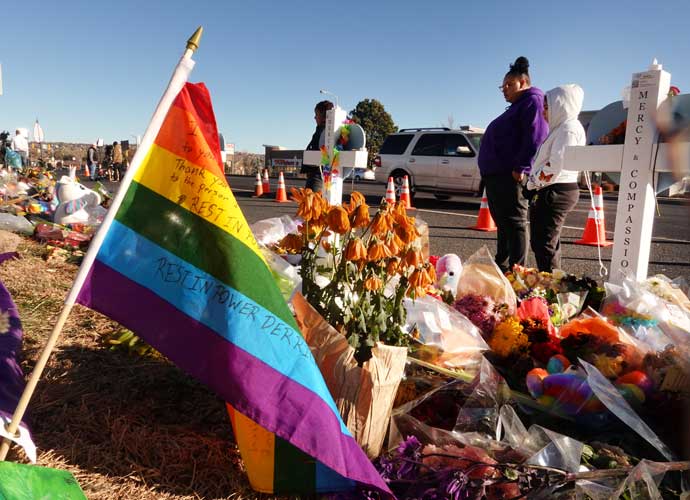 COLORADO SPRINGS, COLORADO - NOVEMBER 22: People visit a makeshift memorial near the Club Q nightclub on November 22, 2022 in Colorado Springs, Colorado. On November 19, a 22-year-old gunman entered the LGBTQ nightclub and opened fire, killing five people before being tackled and disarmed by a club patron. (Photo by Scott Olson/Getty Images)