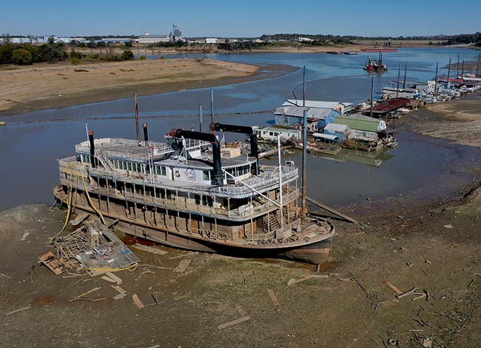 MEMPHIS, TENNESSEE - OCTOBER 19: The Diamond Lady, a once majestic riverboat, rests with smaller boats in mud at Riverside Park Marina in Martin Luther King Jr. Riverside Park along the Mississippi River on October 19, 2022 in Memphis, Tennessee. Lack of rain in the Ohio River Valley and along the Upper Mississippi has the Mississippi River south of the confluence of the Ohio River nearing record low levels which is wreaking havoc at marinas, and with barge traffic, driving up shipping prices and threatening crop exports and fertilizer shipments as the soybean and corn harvest gets into full swing. (Photo by Scott Olson/Getty Images)