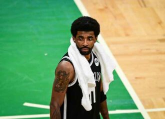BOSTON, MASSACHUSETTS - MAY 30: Kyrie Irving #11 of the Brooklyn Nets looks on during Game Four of the Eastern Conference first round series against the Boston Celtics at TD Garden on May 30, 2021 in Boston, Massachusetts. (Photo by Maddie Malhotra/Getty Images)