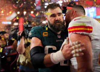 GLENDALE, AZ - FEBRUARY 12: Jason Kelce #62 of the Philadelphia Eagles speaks with Travis Kelce #87 of the Kansas City Chiefs after Super Bowl LVII at State Farm Stadium on February 12, 2023 in Glendale, Arizona. The Chiefs defeated the Eagles 38-35. (Photo by Cooper Neill/Getty Images)
