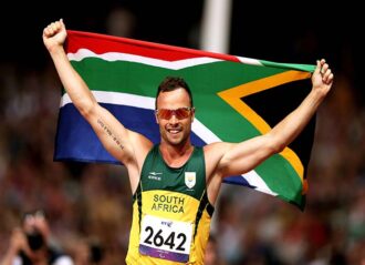 LONDON, ENGLAND - SEPTEMBER 08: Oscar Pistorius of South Africa celebrates as he wins gold in the Men's 400m T44 Final on day 10 of the London 2012 Paralympic Games at Olympic Stadium on September 8, 2012 in London, England. (Photo by Bryn Lennon/Getty Images)