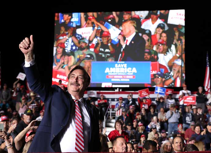 MINDEN, NEVADA - OCTOBER 08: My Pillow CEO Mike Lindell gives a thumbs-up as former U.S. President Donald Trump speaks during a campaign rally at Minden-Tahoe Airport on October 08, 2022 in Minden, Nevada. Former U.S. President Donald Trump held a campaign style rally for Nevada GOP candidates ahead of the state's midterm election on November 8th. (Photo by Justin Sullivan/Getty Images)