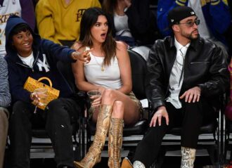 LOS ANGELES, CALIFORNIA - MAY 12: Yung Taco, Renell Medrano, Kendall Jenner and Bad Bunny attend the Western Conference Semifinal Playoff game between the Los Angeles Lakers and Golden State Warriors at Crypto.com Arena on May 12, 2023 in Los Angeles, California. (Photo by Kevork Djansezian/Getty Images)