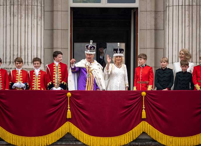 LONDON, ENGLAND - MAY 06: Getty Images photographer Chris Jackson photographs King Charles III and Queen Camilla on the Buckingham Palace balcony during the flypast during the Coronation of King Charles III and Queen Camilla on May 06, 2023 in London, England. The Coronation of Charles III and his wife, Camilla, as King and Queen of the United Kingdom of Great Britain and Northern Ireland, and the other Commonwealth realms takes place at Westminster Abbey today. Charles acceded to the throne on 8 September 2022, upon the death of his mother, Elizabeth II. (Photo by Christopher Furlong/Getty Images)