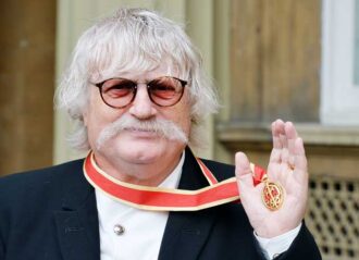 LONDON, UNITED KINGDOM - OCTOBER 06: Sir Karl Jenkins holds his Insignia of Knighthhod award, after it was presented to him by the Princess Royal, at the Investiture ceremony at Buckingham Palace on October 6, 2015 in London. (Photo by John Stillwell - WPA Pool/Getty Images)