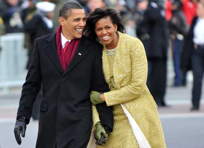 WASHINGTON - JANUARY 20: President Barack Obama and first lady Michelle Obama walk in the Inaugural Parade on January 20, 2009 in Washington, DC. Obama was sworn in as the 44th President of the United States, becoming the first African-American to be elected President of the US. He is wearing a Brooks Brothers suit and overcoat. (Photo by Ron Sachs-Pool/Getty Images)