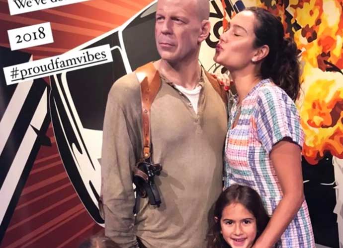 Emma Heming Willis with daughters Mable and Evelyn kiss dad Bruce Willis's statue at Madame Tussaud's Wax Museum (Image: Instagram)