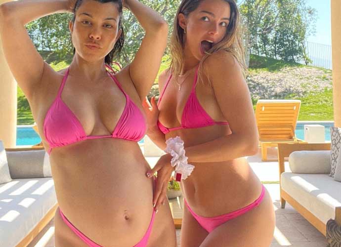 Pregnant Kourtney Kardashian shows off baby bump in pink bikini (Image: Instagram)