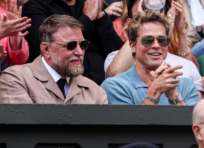 LONDON, ENGLAND - JULY 16: Guy Ritchie (L) and Brad Pitt (C) look on during the Men's Single final match between Novak Djokovic of Serbia and Carlos Alcaraz of Spain during day fourteen of The Championships Wimbledon 2023 at All England Lawn Tennis and Croquet Club on July 16, 2023 in London, England. (Photo by Shi Tang/Getty Images)