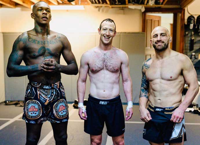Mark Zuckerberg poses shirtless with UFC fighters Israel Adesanya and Alex Volkanvski (Image: Instagram)