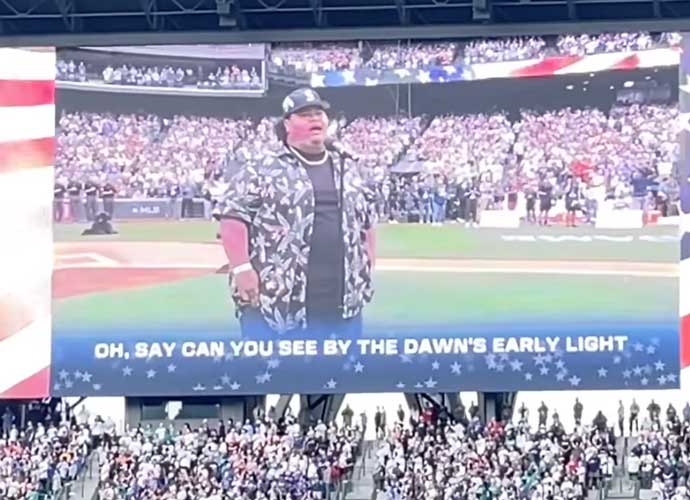 Iam Tongi forgets to take off his hat while singing the National Anthem (Image: YouTube)