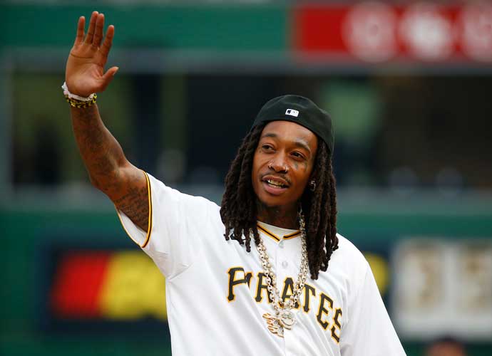 PITTSBURGH, PA - JULY 17: Wiz Khalifa waves to the crowd before the game between the Cleveland Guardians and the Pittsburgh Pirates at PNC Park on July 17, 2023 in Pittsburgh, Pennsylvania. (Photo by Justin K. Aller/Getty Images
