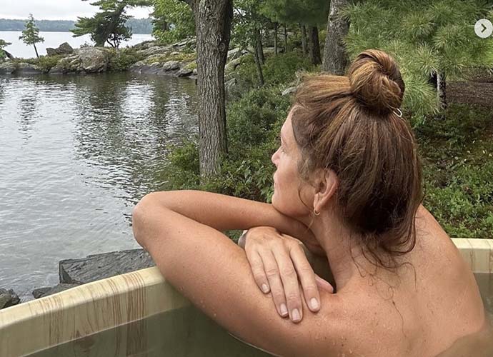 Cindy Crawford poses topless in lake photo (Image: Instagram)