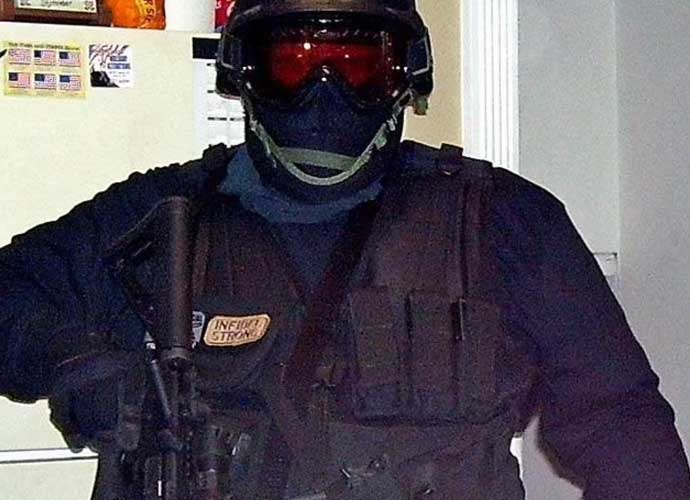 Craig Deleeuw Robertson shows of body armor (Image: Facebook)
