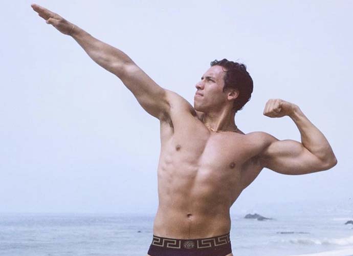 Joseph Baena poses in dad Arnold Schwarzenegger's famous pose (Image: Instagram)