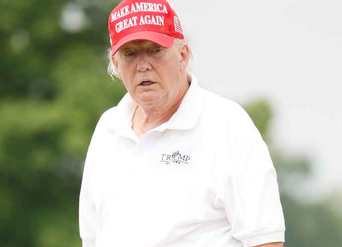 BEDMINSTER, NEW JERSEY - JULY 28: Former U.S. President Donald Trump reacts to a putt on the 15th green during the pro-am prior to the LIV Golf Invitational - Bedminster at Trump National Golf Club Bedminster on July 28, 2022 in Bedminster, New Jersey. (Photo by Cliff Hawkins/Getty Images)