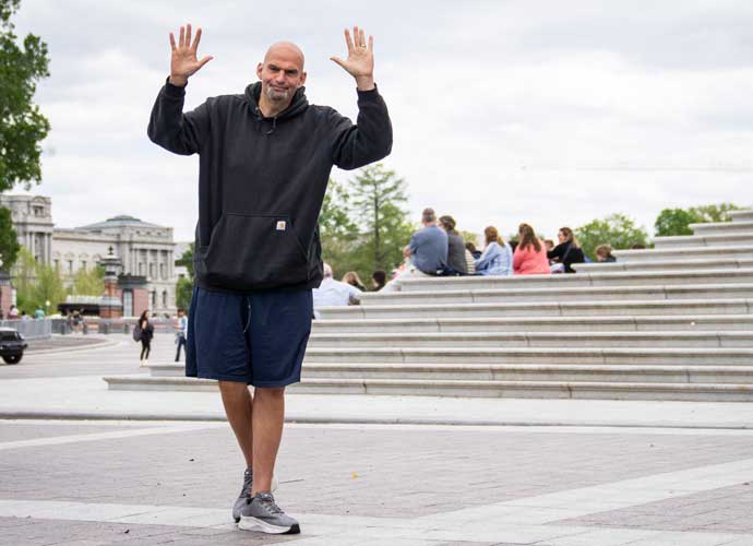 WASHINGTON, DC - APRIL 17: U.S. Sen. John Fetterman (D-PA) waves to reporters as he arrives at the U.S. Capitol on April 17, 2023 in Washington, DC. Fetterman is returning to the Senate following six weeks of treatment for clinical depression. (Photo by Drew Angerer/Getty Images)