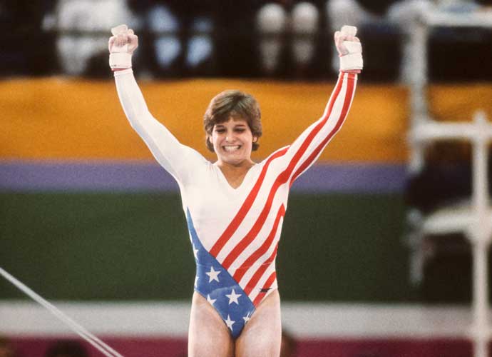 LOS ANGELES - AUGUST 1984: Mary Lou Retton of the USA celebrates following her uneven parallel bar performance during the Women's Gymnastics competition of the 1984 Summer Olympic Games held from July 30 to August 3, 1984 at Pauley Pavilion in Los Angeles, California. (Photo by David Madison/Getty Images)