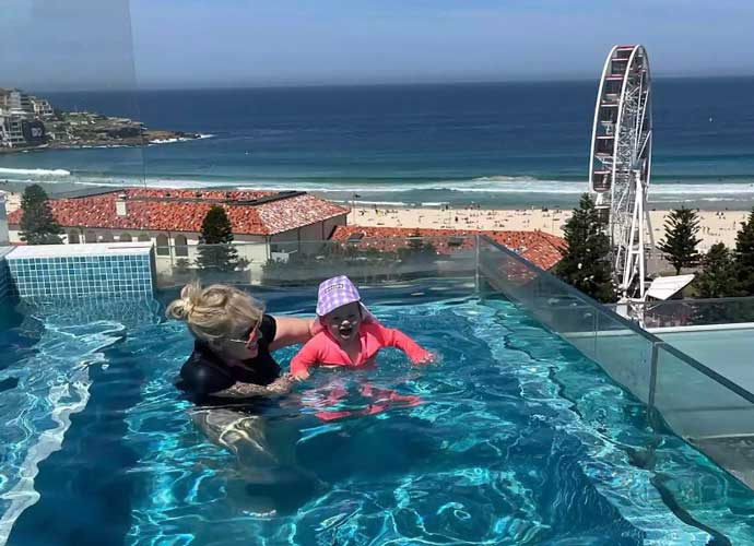 Rebel Wilson at apartment in Bondi Beach, Australia, with daughter Royce (Image: Instagram)