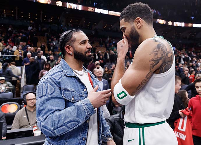 TORONTO, CANADA - NOVEMBER 17: Rapper Drake greets Jayson Tatum #0 of the Boston Celtics after their NBA In-Season Tournament game against the Toronto Raptors at Scotiabank Arena on November 17, 2023 in Toronto, Canada. (Photo by Cole Burston/Getty Images)