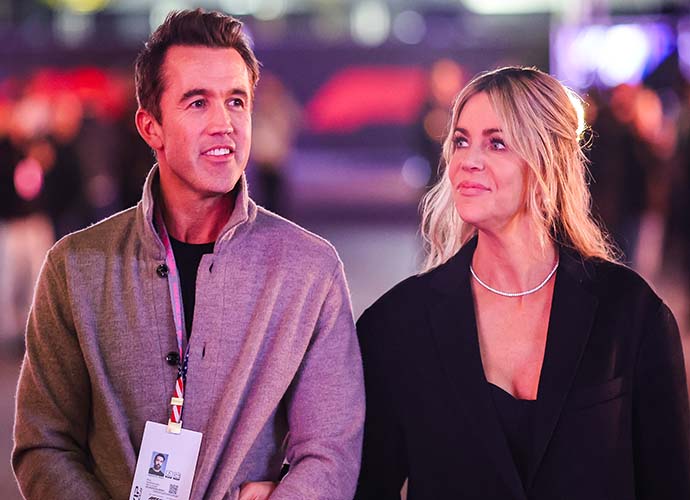 LAS VEGAS, NEVADA - NOVEMBER 17: Rob McElhenney and Kaitlin Olson walking the paddock during qualifying ahead of the F1 Grand Prix of Las Vegas at Las Vegas Strip Circuit on November 17, 2023 in Las Vegas, Nevada. (Photo by Kym Illman/Getty Images)