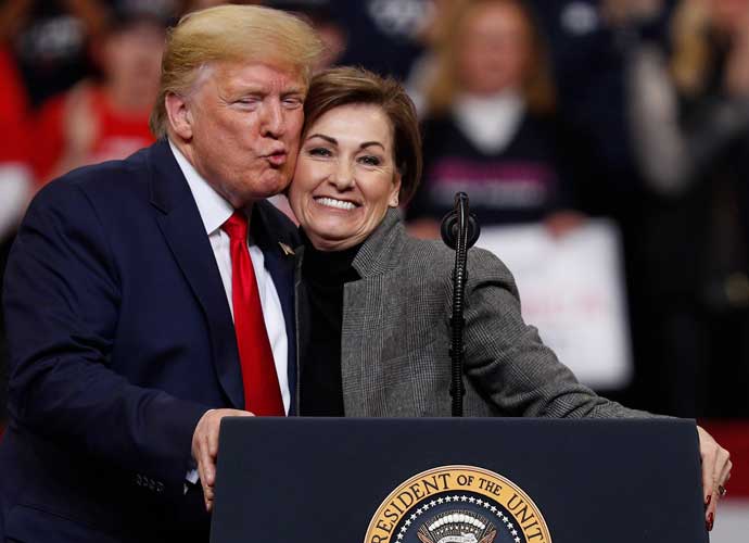 DES MOINES, IA - JANUARY 30: U.S. President Donald Trump gives a kiss on the cheek to Iowa Governor Kim Reynolds during a campaign rally inside of the Knapp Center arena at Drake University on January 30, 2020 in Des Moines, Iowa. President Trump is campaigning in Iowa a few days before nation’s first presidential caucuses. (Photo by Tom Brenner/Getty Images)