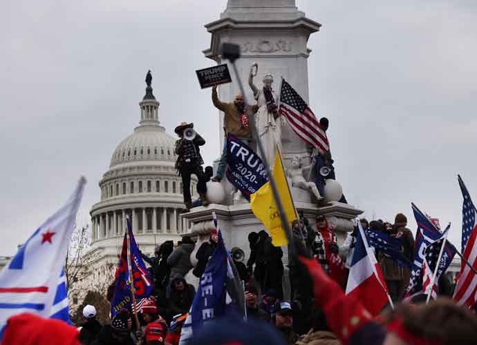 WASHINGTON, DC - JANUARY 06: Trump supporters gather outside the U.S. Capitol building following a 