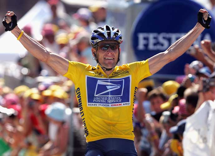 LE GRAND BORNAND, FRANCE - JULY 22: Lance Armstrong of the USA and riding for US Postal Service presented by Berry Floor celebrates as he wins stage 17 of the Tour de France on July 22, 2004 from Bourg d'Oisans to le Grand Bornand, France. (Photo by Doug Pensinger/Getty Images)