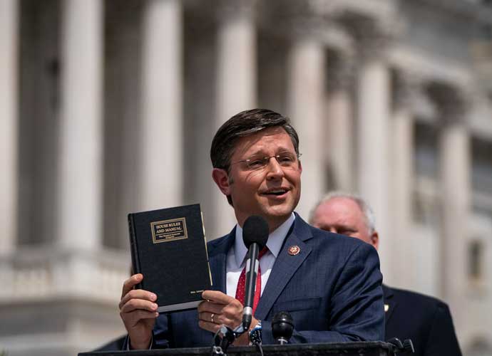 WASHINGTON, DC - MAY 27: Rep. Mike Johnson (R-LA) holds up a House Rules and Manual book during a news conference outside the U.S. Capitol, May 27, 2020 in Washington, DC. Calling it unconstitutional, Republican leaders have filed a lawsuit against House Speaker Nancy Pelosi and congressional officials in an effort to block the House of Representatives from using a proxy voting system to allow for remote voting during the coronavirus pandemic. (Photo by Drew Angerer/Getty Images)