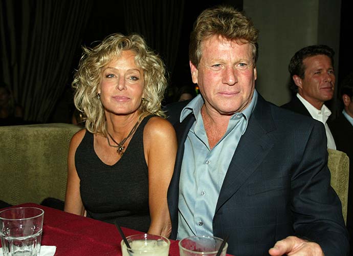 LOS ANGELES - APRIL 10: Actors Farrah Fawcett (L) and Ryan O'Neal relax at the after-party for 