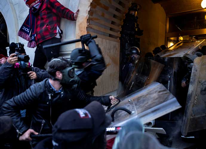 WASHINGTON, DC - JANUARY 6: Trump supporters clash with police and security forces as people try to storm the US Capitol on January 6, 2021 in Washington, DC. - Demonstrators breeched security and entered the Capitol as Congress debated the 2020 presidential election Electoral Vote Certification. (photo by Brent Stirton/Getty Images)