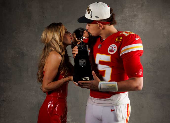 LAS VEGAS, NEVADA - FEBRUARY 11: Patrick Mahomes #15 (R) of the Kansas City Chiefs and Brittany Mahomes pose for a portrait with the Vince Lombardi Trophy after Super Bowl LVIII against the San Francisco 49ers at Allegiant Stadium on February 11, 2024 in Las Vegas, Nevada. (Photo by Ryan Kang/Getty Images)