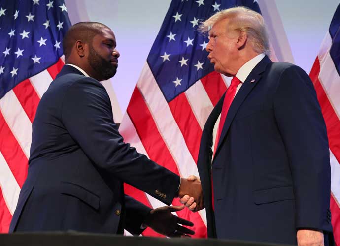 PHILADELPHIA, PENNSYLVANIA - JUNE 30: Rep. Byron Donalds (R-FL) shakes hands with former U.S. President Donald Trump during the Moms for Liberty Joyful Warriors national summit at the Philadelphia Marriott Downtown on June 30, 2023 in Philadelphia, Pennsylvania. The self-labeled 