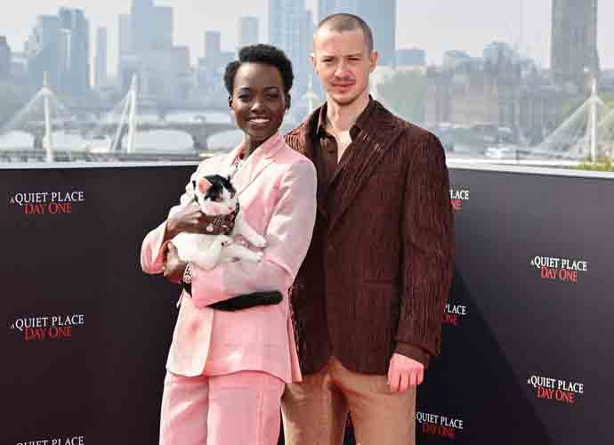 LONDON, ENGLAND - MAY 01: Lupita Nyong'o, Joseph Quinn and Schnitzel the cat attend the photocall for 