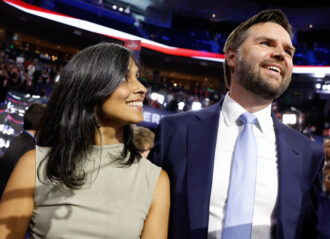 MILWAUKEE, WISCONSIN - JULY 15: U.S. Sen. J.D. Vance (R-OH) and his wife Usha Chilukuri Vance look on as he is nominated for the office of Vice President on the first day of the Republican National Convention at the Fiserv Forum on July 15, 2024 in Milwaukee, Wisconsin. Delegates, politicians, and the Republican faithful are in Milwaukee for the annual convention, concluding with former President Donald Trump accepting his party's presidential nomination. The RNC takes place from July 15-18. (Photo by Anna Moneymaker/Getty Images)