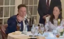 Elon Musk balances cutlery on his finger during dinner with Donald Trump (Credit: @DaoKwonDo via Storyful)